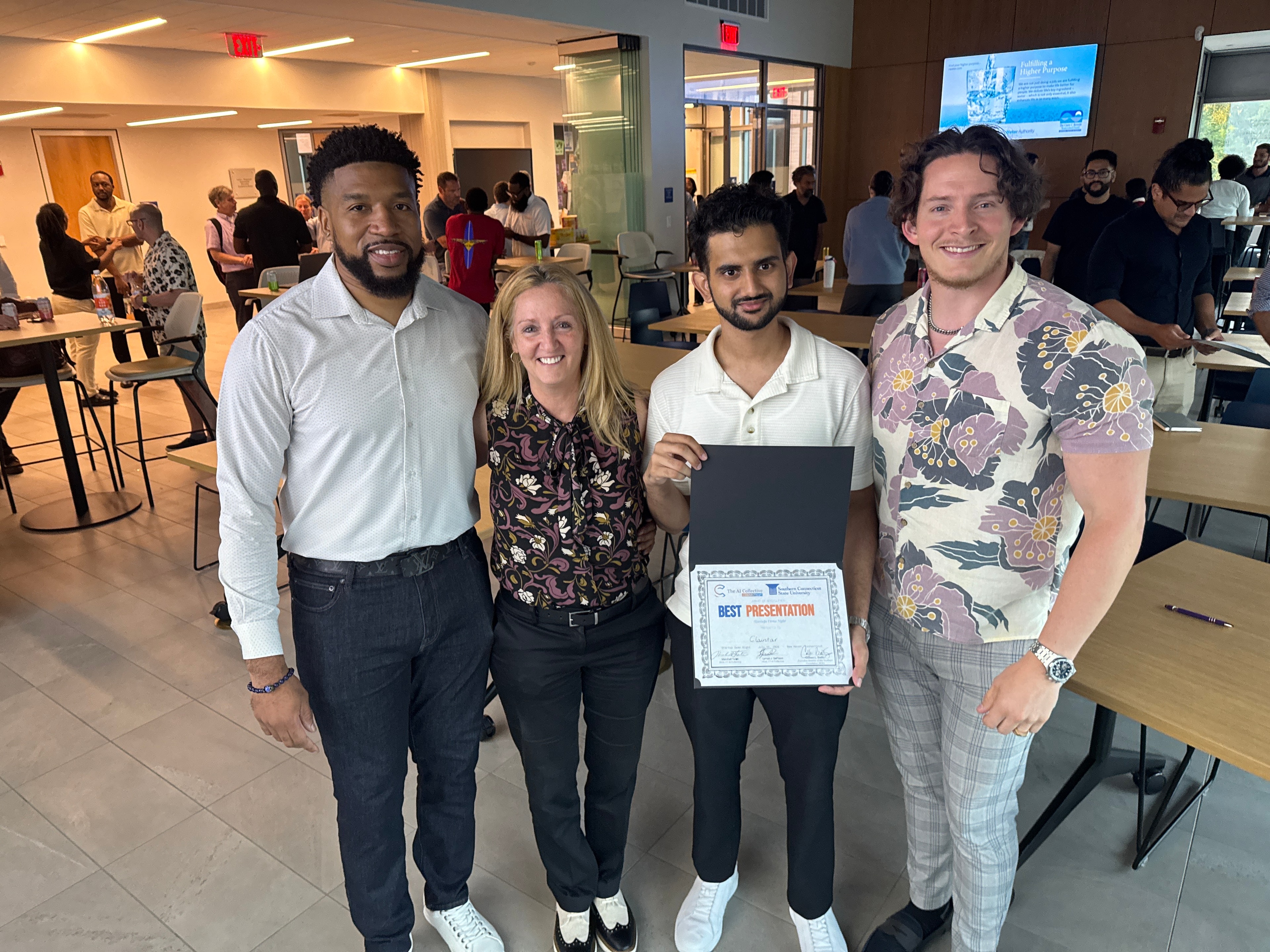 Team holding best presentation award certificate