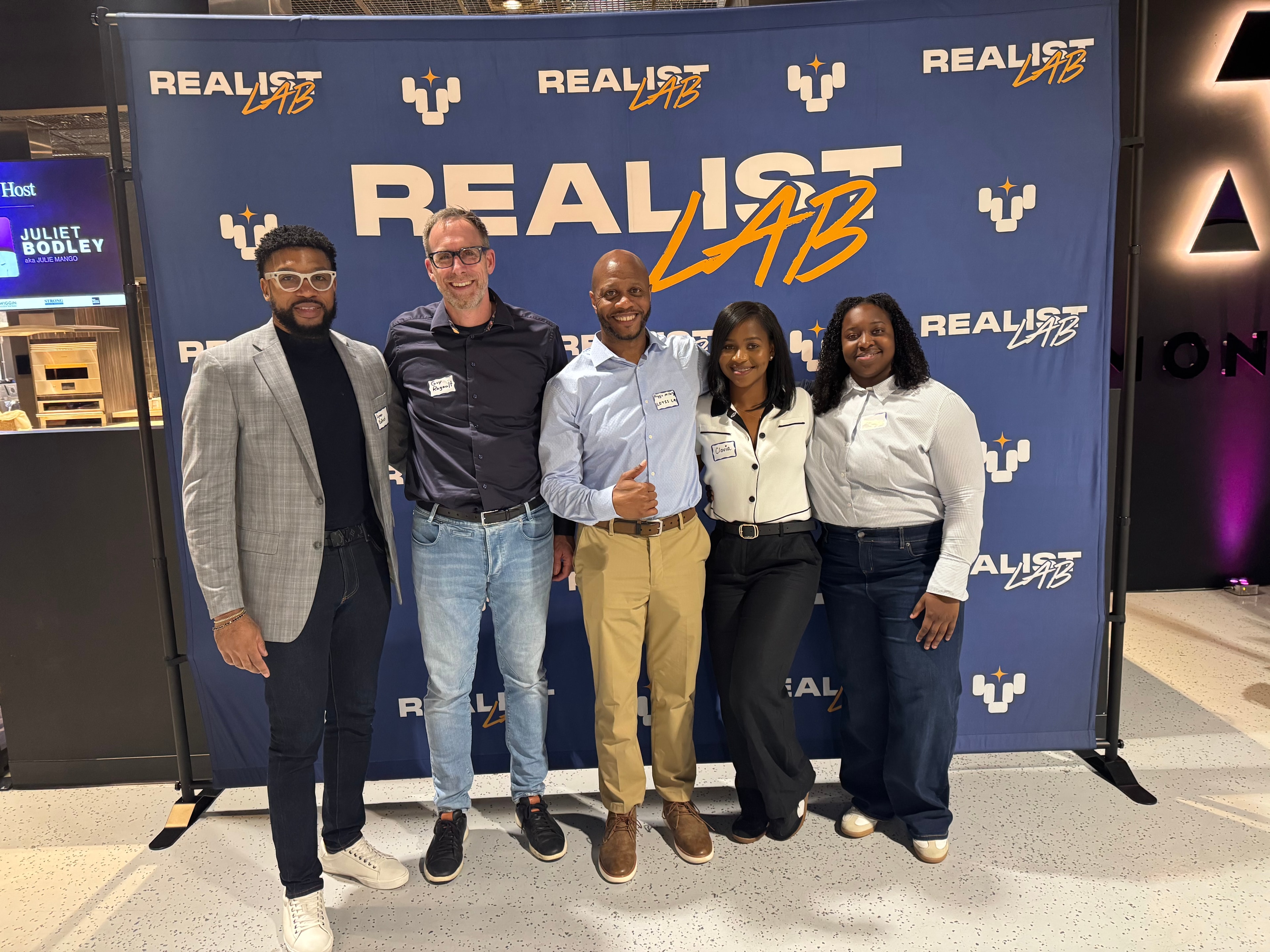 Group posing at Realist Lab event