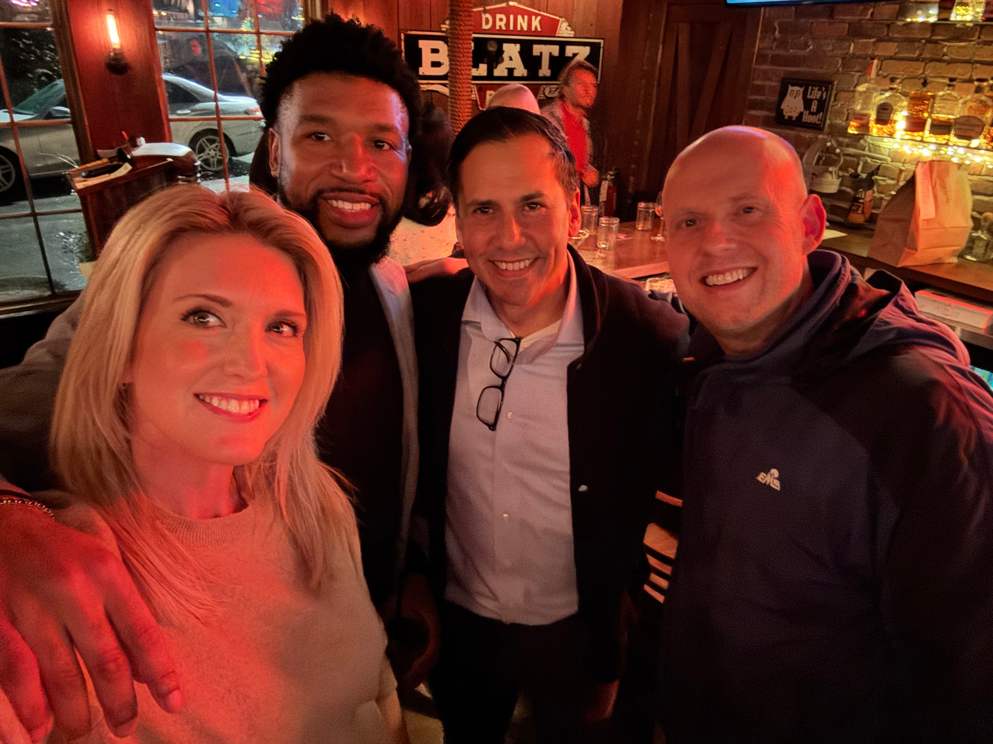 Lyman DePriest with friends at networking event